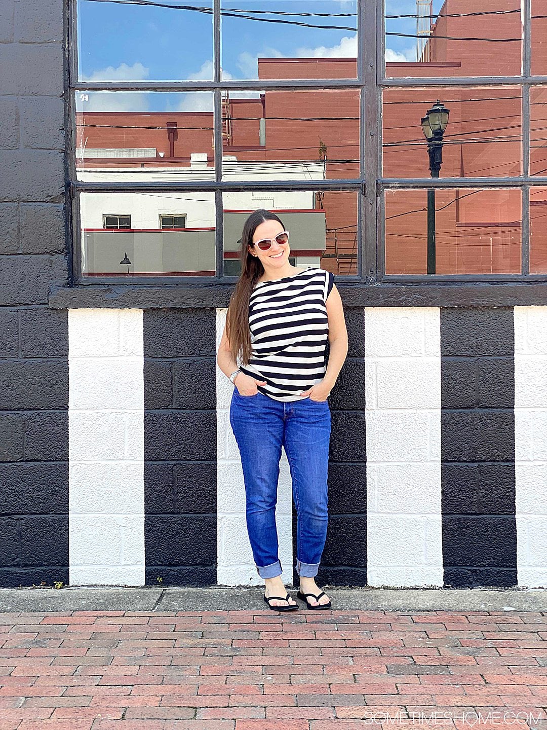 Mural of black and white lines with a woman in a matching top in Goldsboro NC