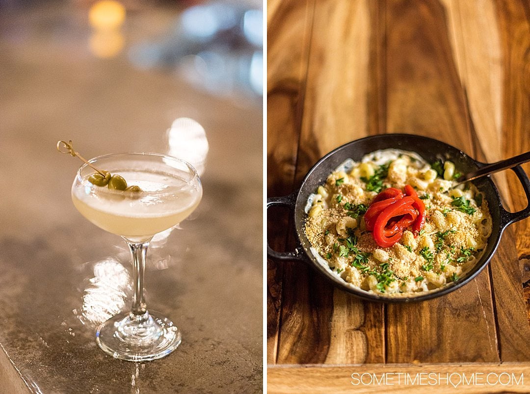 Dirty martini cocktail and macaroni and cheese in an iron skillet