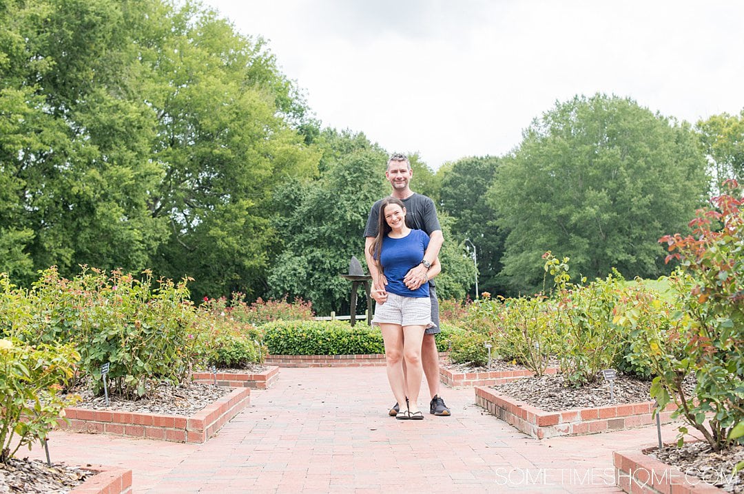 A couple in a rose garden in Chapel Hill.