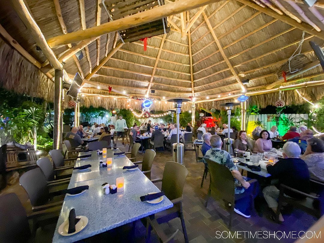 Outdoor patio with a thatched roof at the Lazy Lobster restaurant in Key Largo at the Florida Keys.