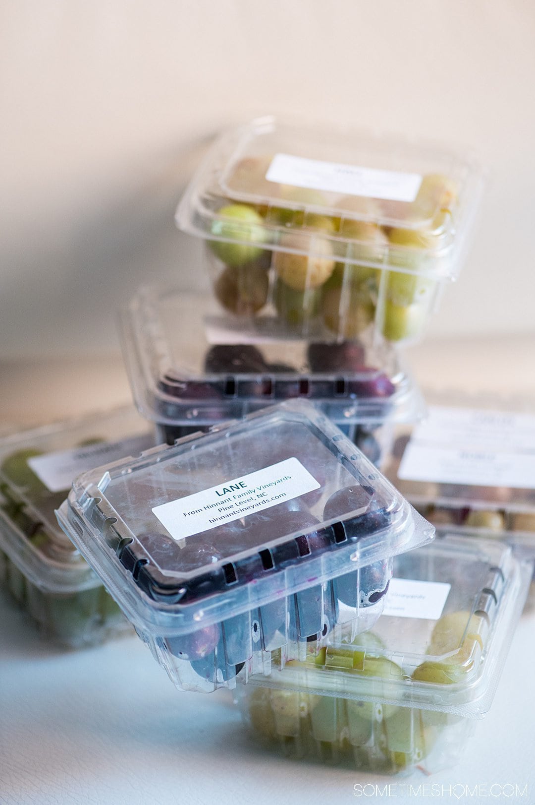 Plastic clamshell boxes of muscadine grapes