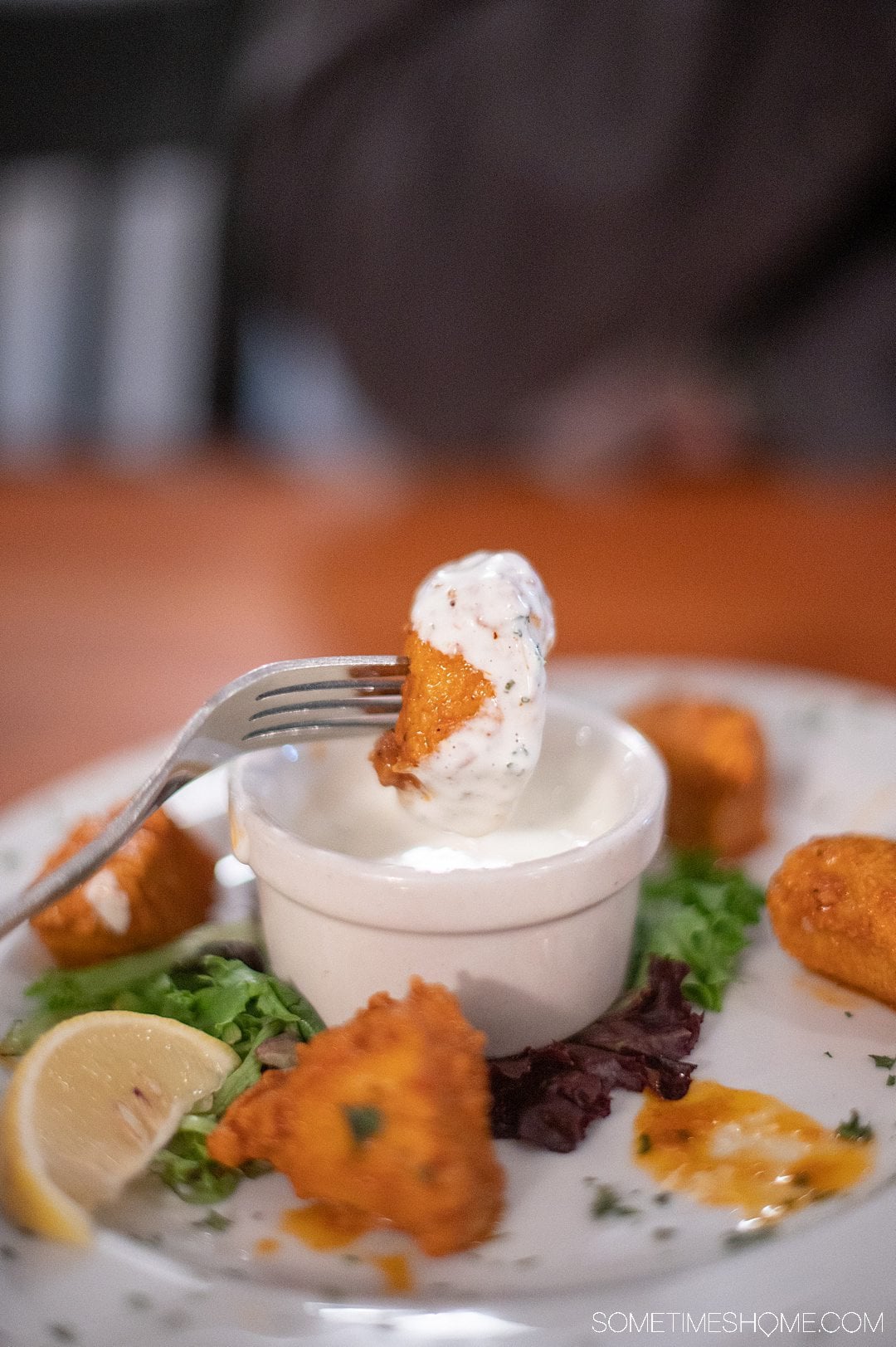 Tuna bites covered in orange Buffalo sauce, dipped in ranch dressing.