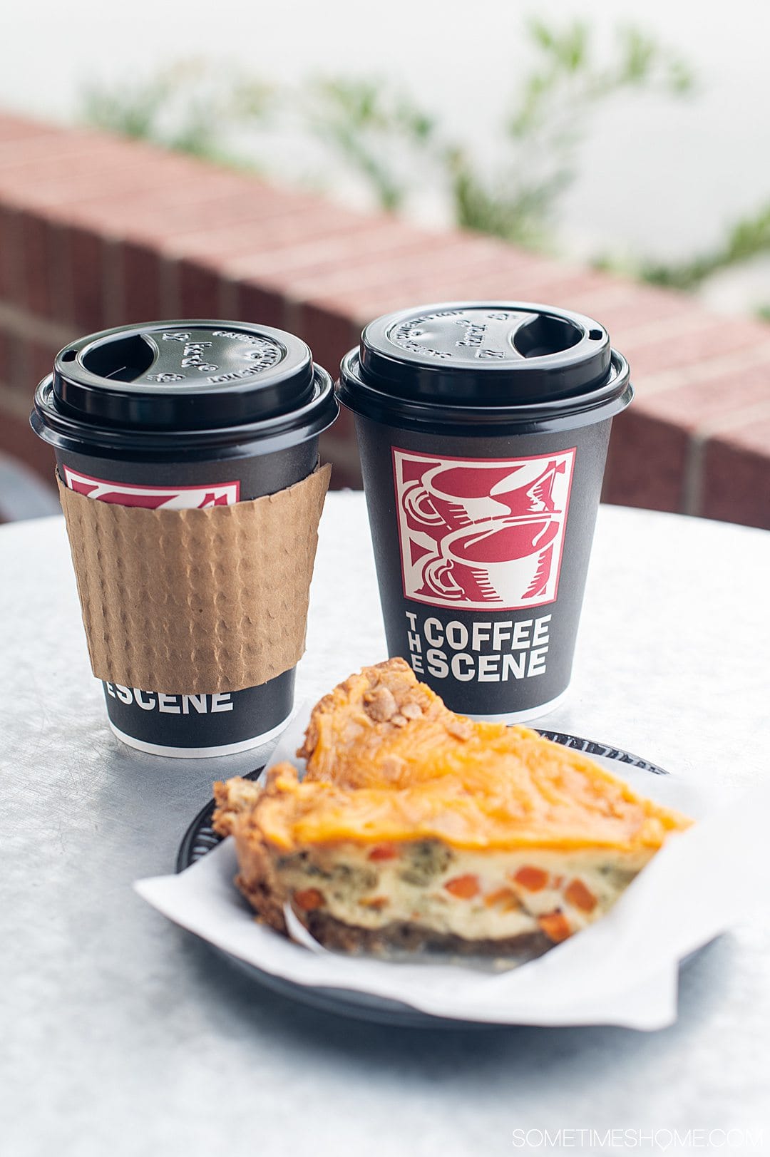 Coffee cups that read, "The Coffee Scene" and a piece of breakfast quiche as one of our date ideas in Fayetteville, NC.