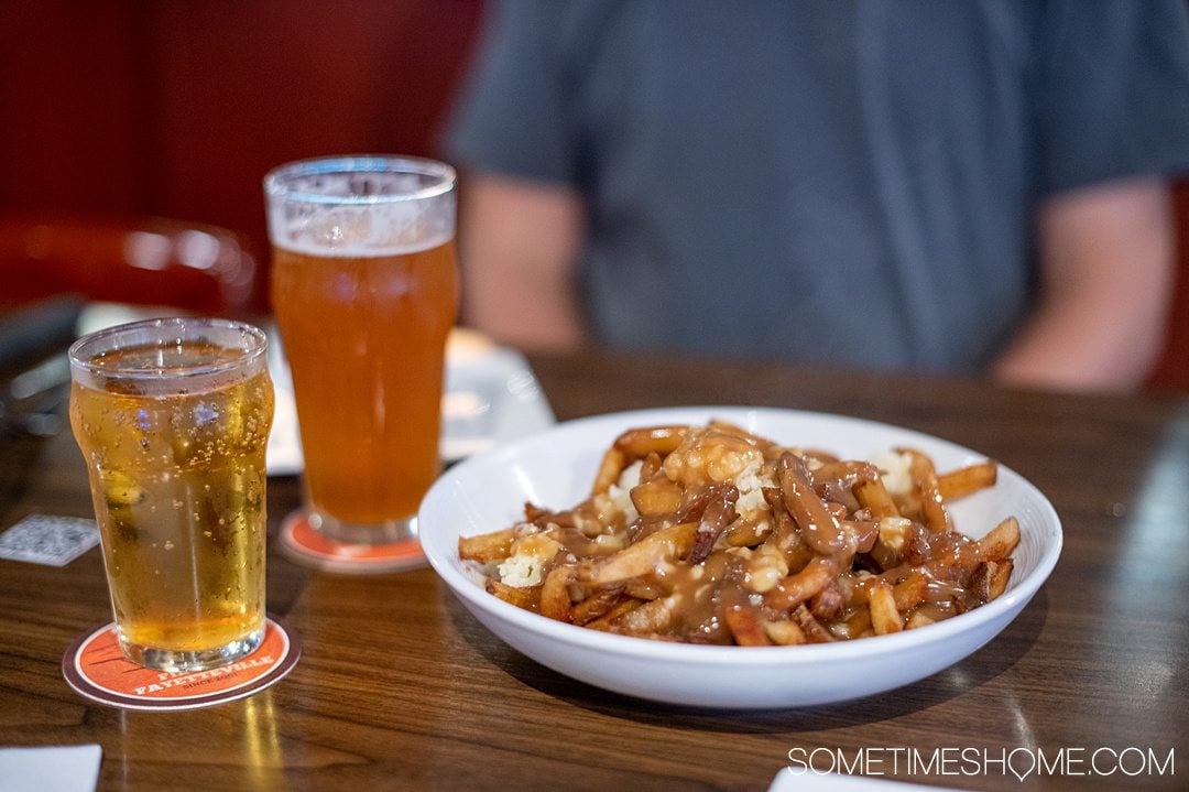 Bowl of French fries, gravy and cheese curd poutine at restaurant and brewery Mash House in Fayetteville, NC.