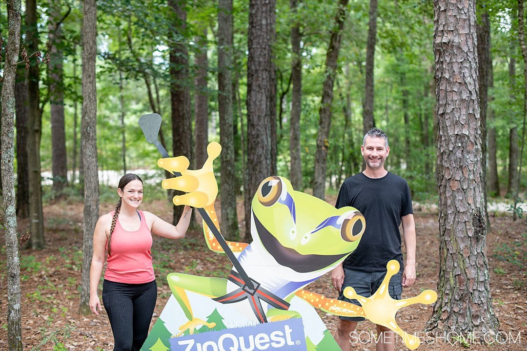A couple with a frog cutout at Zipquest in Fayetteville, NC. 