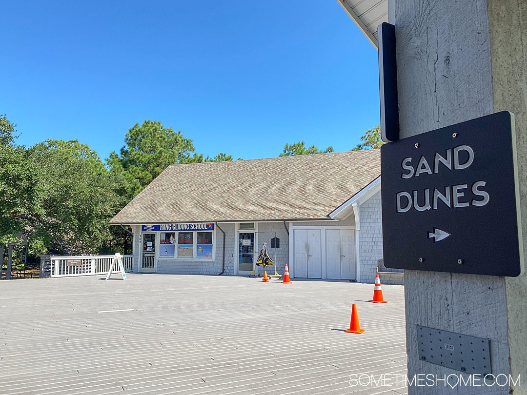 A grey building with orange traffic cones on the deck at Jockey's Ridge State Park in the Outer Banks.