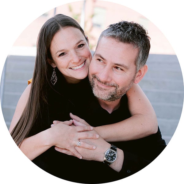 Photo of a woman with her arms around a man.