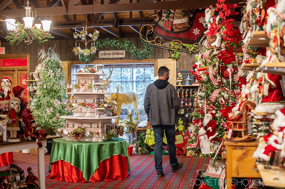 A man browsing the items at a Christmas shop in the Outer Banks.