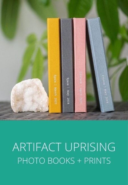Image of colorful Artifact Uprising photo books in yellow, grey, pink and blue.
