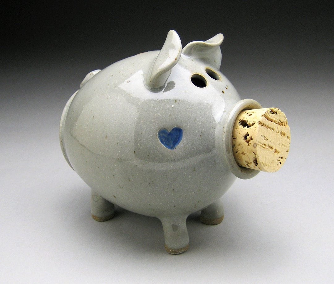 Modern white piggy back with a blue heart on its cheek from Seagrove, NC potter.