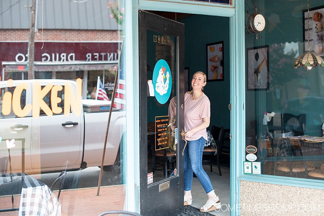 Things to do in Warrenton: visit Chilly Chicken Creamery! Photo of a woman passing through the door to the shop.