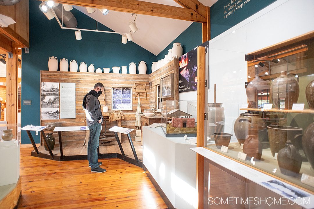 Man looking at an exhibit at the North Carolina Pottery Center in Seagrove, NC.