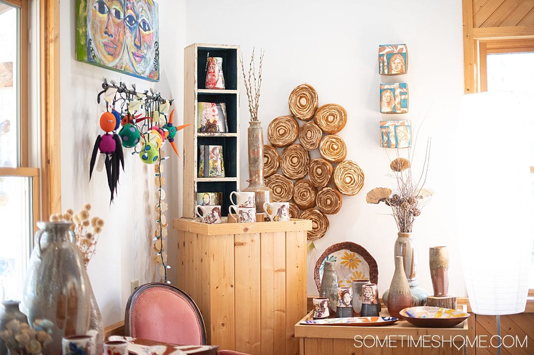 Shelves and a display of pottery by Stephanie Nicole Martin at Dean & Martin Potter studio in Seagrove, NC.