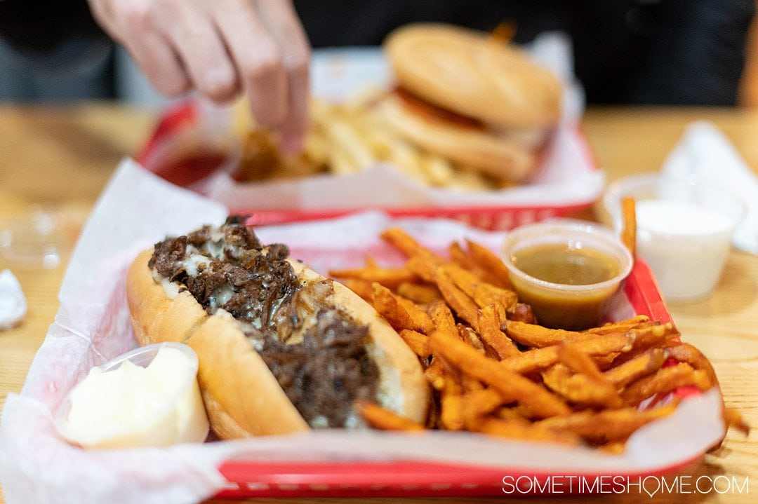 Philly cheesesteak with sweet potatoe fries at a restaurant in Asheboro, NC.