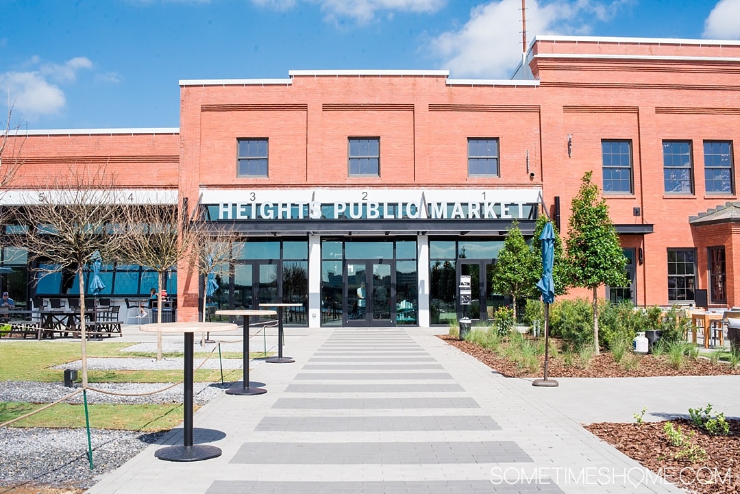 Red brick building with "Heights Public Market" letters on it.