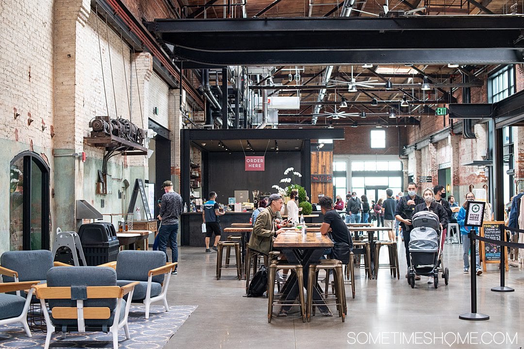 Industrial inspired interior of Armature Works food hall in Tampa, Florida.