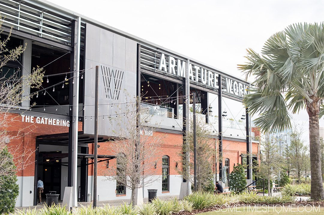 Brick and metal exterior of Armature Works food hall in Tampa Bay.