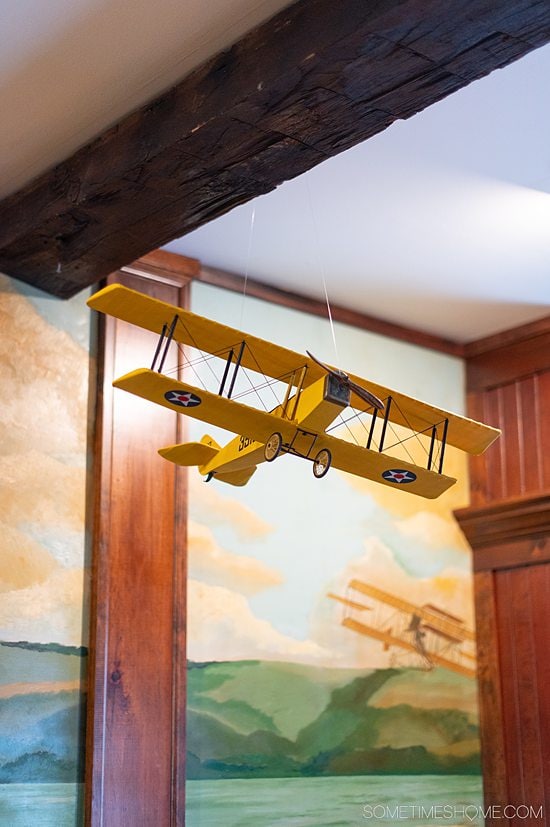 Model airplane in front of a mural of the sky at The Park Inn restaurant in Hammondsport, NY.