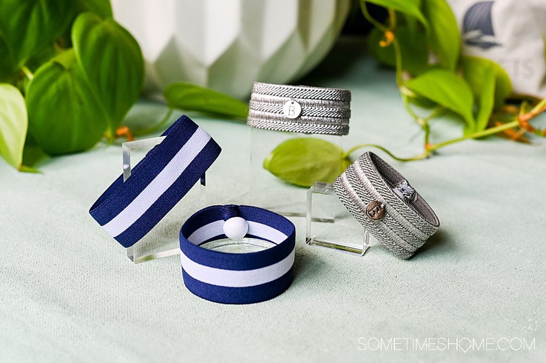 Blisslets fashionable anti-nausea wristbands in silver and blue and white striped, for a year-round Disney World and Universal Packing List.