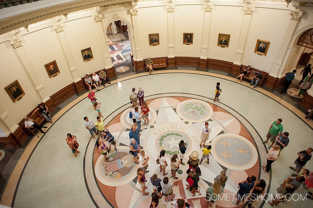 Looking down on the marble floor in the main area of the Austin, Texas capitol building.