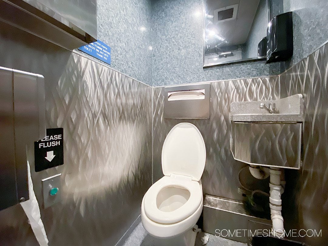 White toilet inside a small bathroom on a Catalina Express ship.