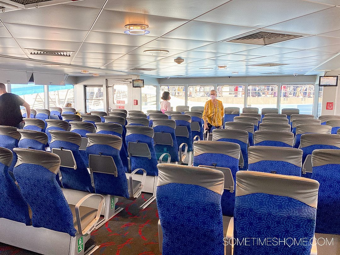 Blue seats inside the Catalina Express boat.