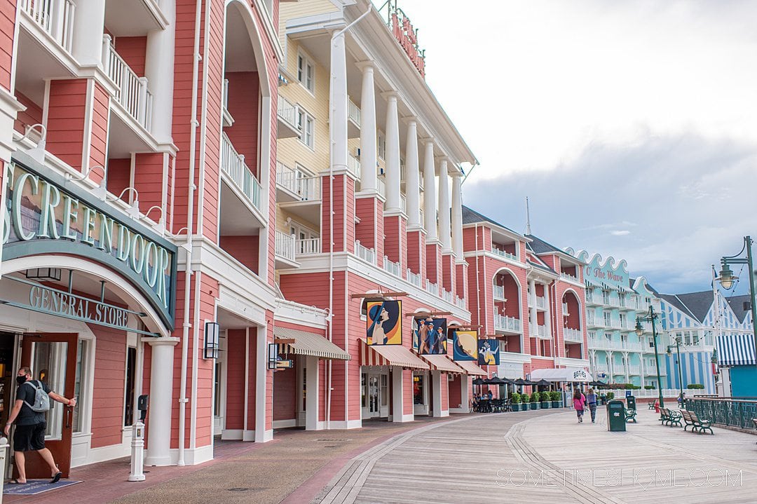 Colorful pink, yellow and mint green facade of the buildings on Disney's BoardWalk.