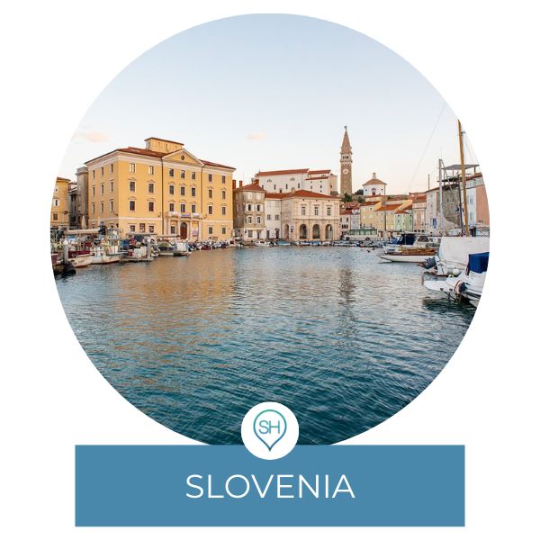 Slovenia category on Sometimes Home travel blog with a picture of Piran on the Adriatic Sea.