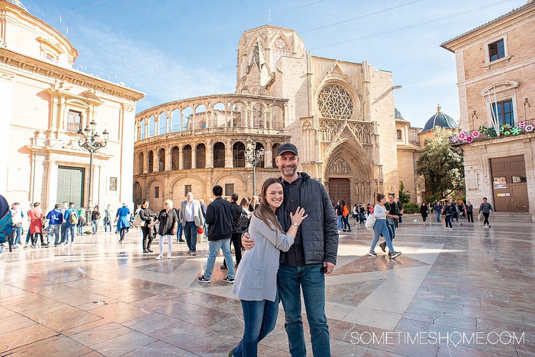 Couple in front of a historic building in Valenica, Spain.