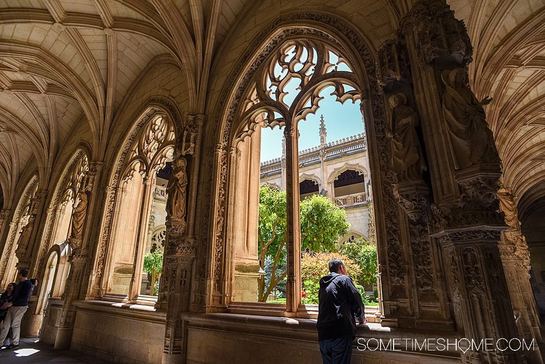 Looking out a courtyard window into a garden in Toledo, Spain.