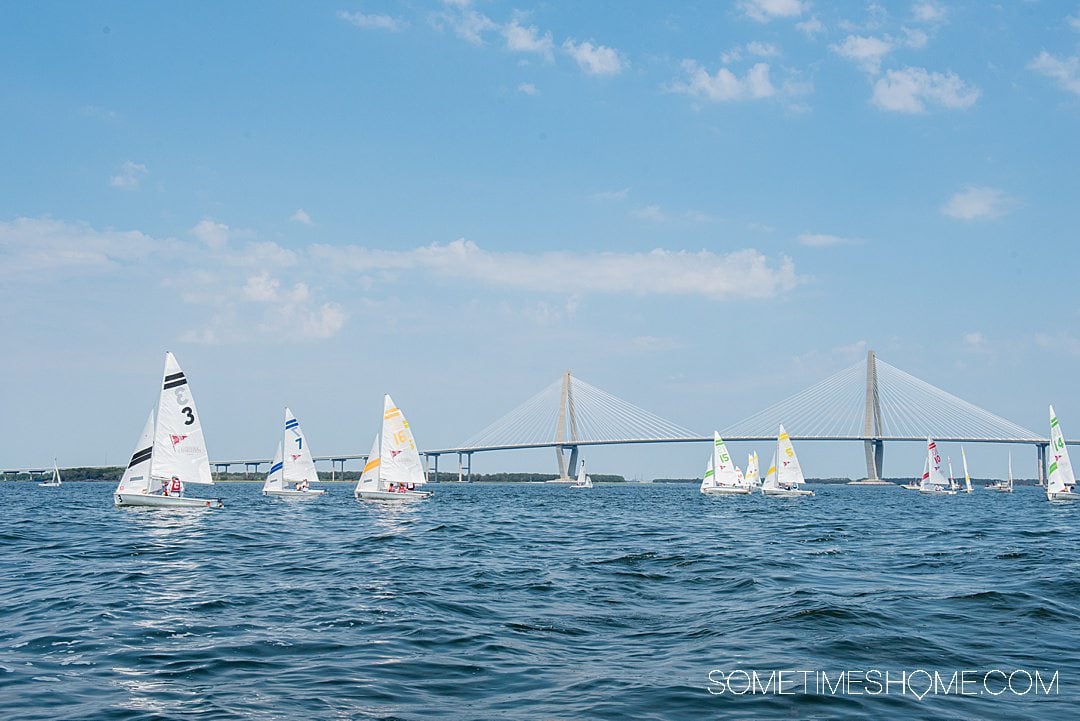 Charleston Harbor with sailboats and Ravenel Bridge in the distance in Charleston, SC.