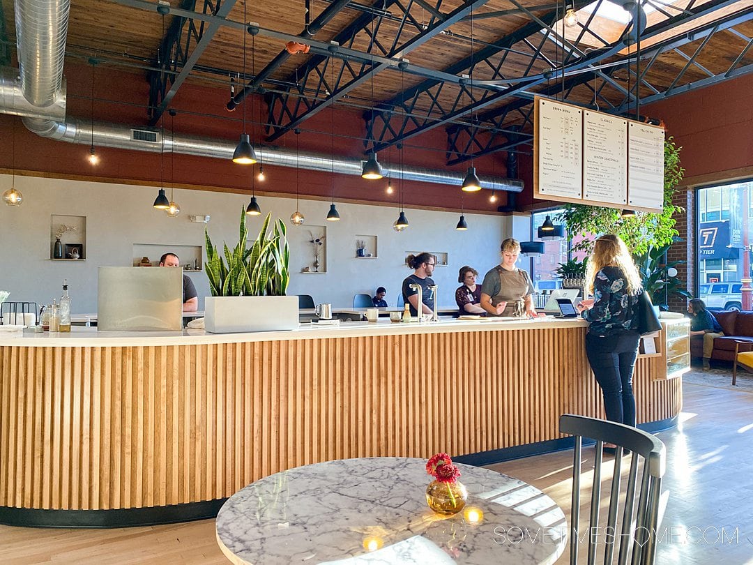 Wooden bar with a white top in the distance at a tea place in Winston-Salem.