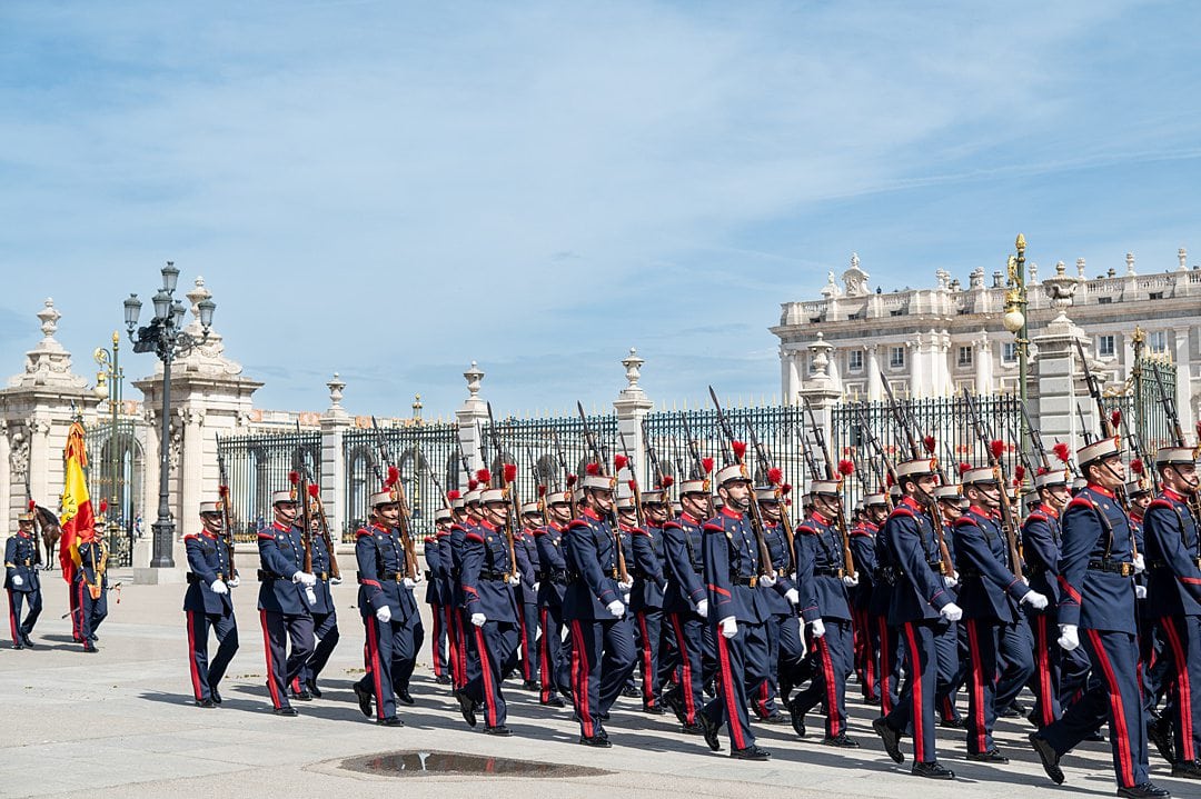Royal Guard walking in front of the Royal Palace of Madrid during an official ceremony. 