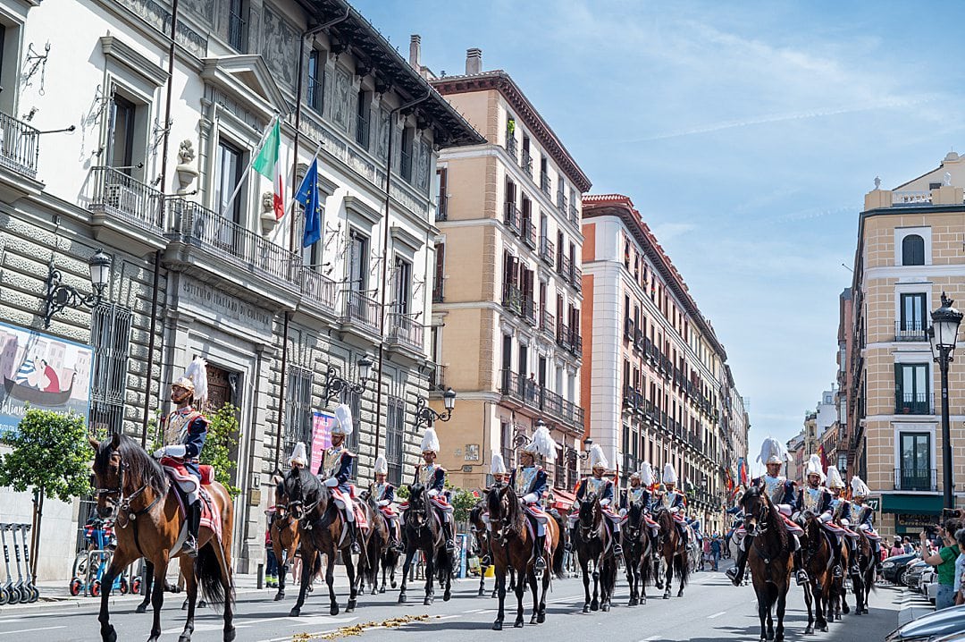 Royal Guard on horseback parading down Calle Mayor in Madrid during an official ceremony.