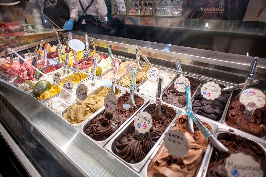Gelato flavors in a case inside an ice cream store in Florence.