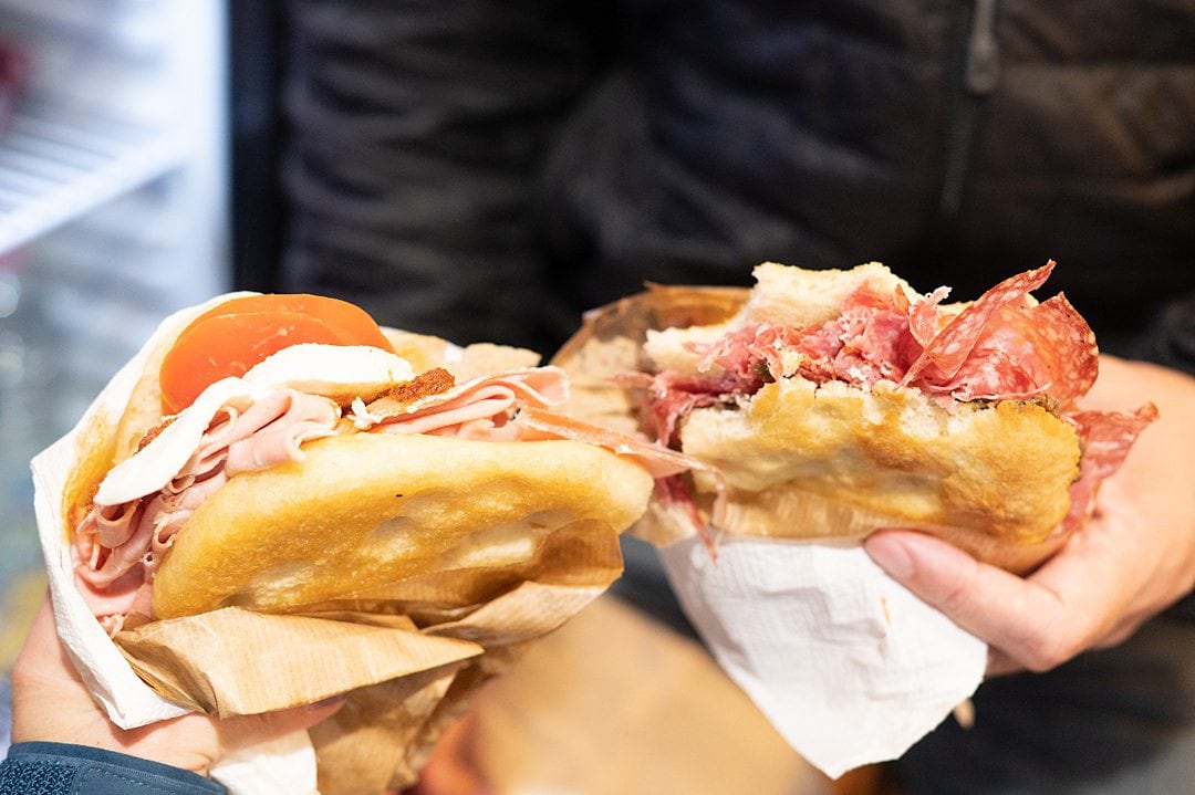 Two sandwiches with meat, cheese and vegetables in Florence.