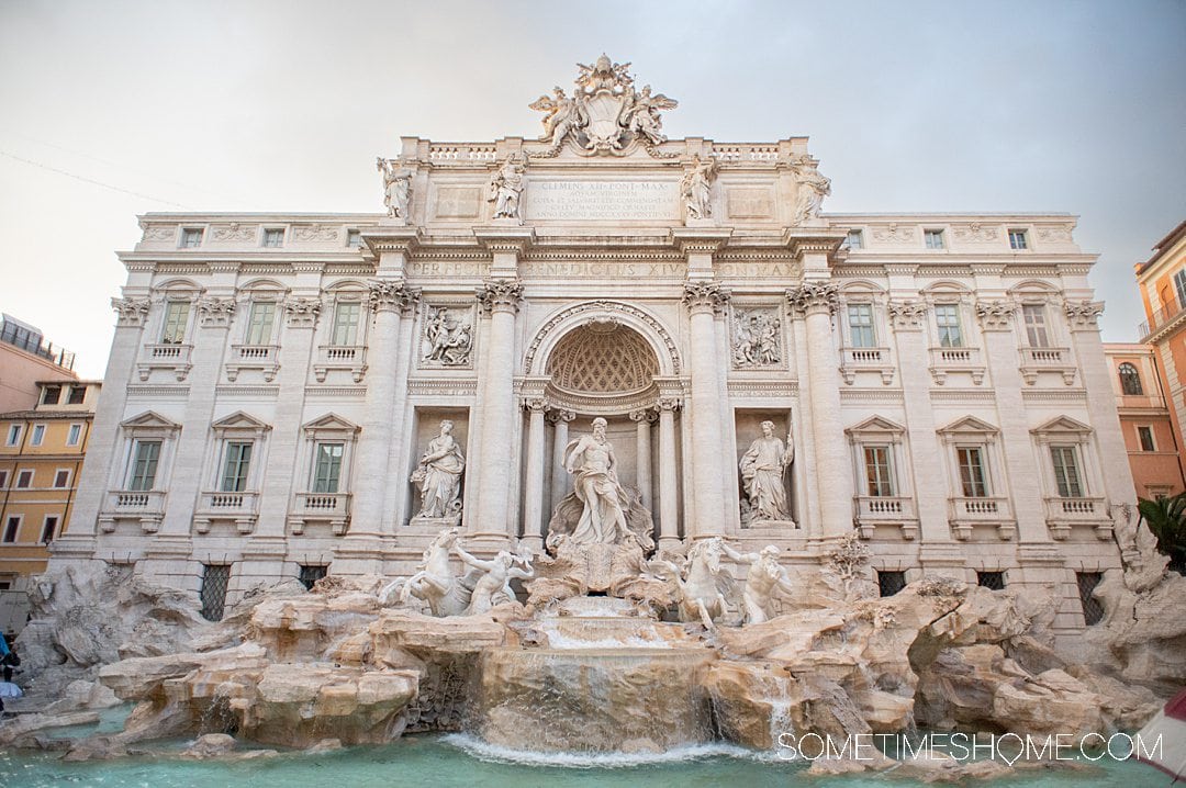 Famous Rome landmark, Trevi Fountain, during sunset in Italy. 