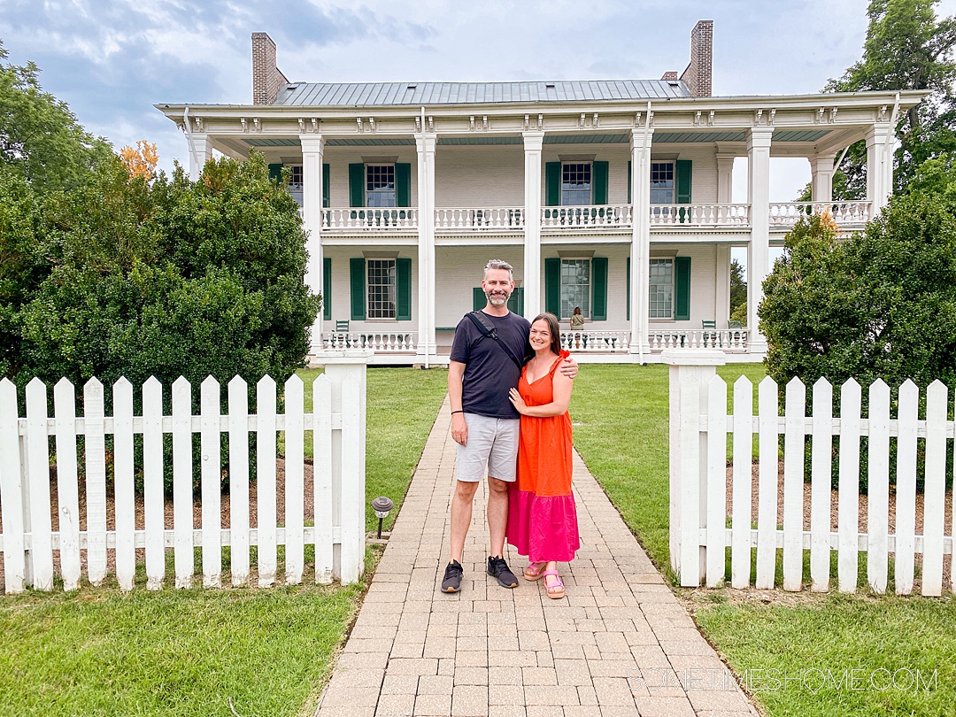 Couple in front of a historic home in Franklin, TN that was involved with the Civil War.