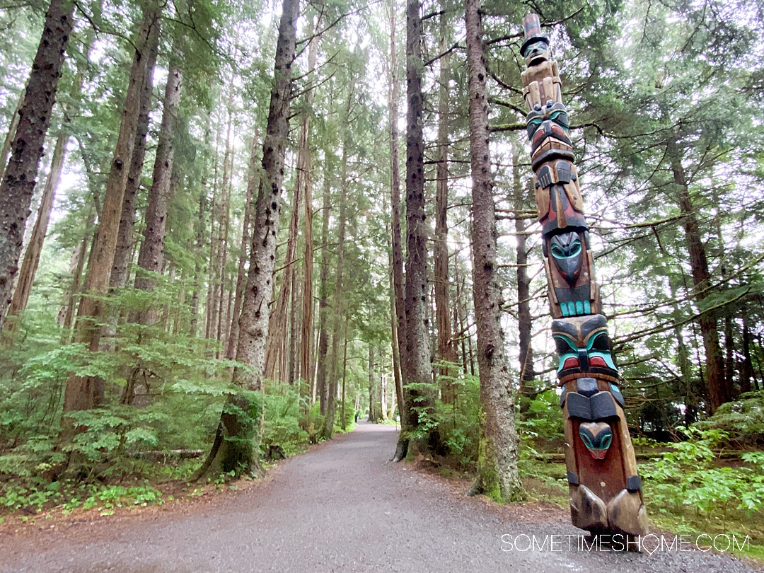 Woods in Sitka, Alaska, with a totem pole on the right.