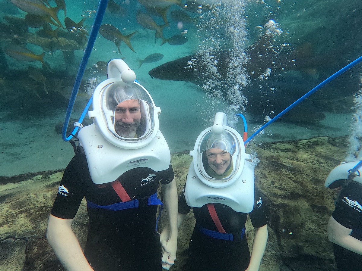 A couple underwater at the SeaVenture experience at Discovery Cove.