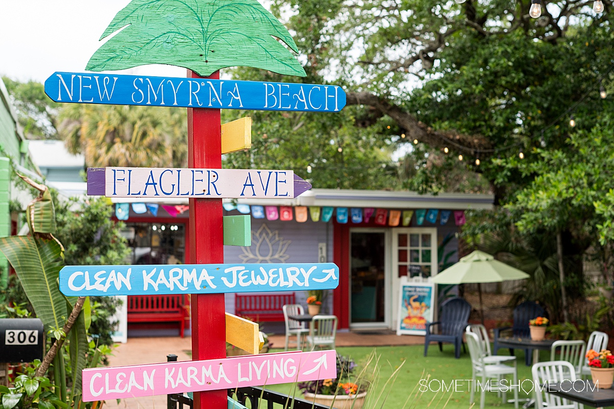 Colorful directional signs in front of a shop