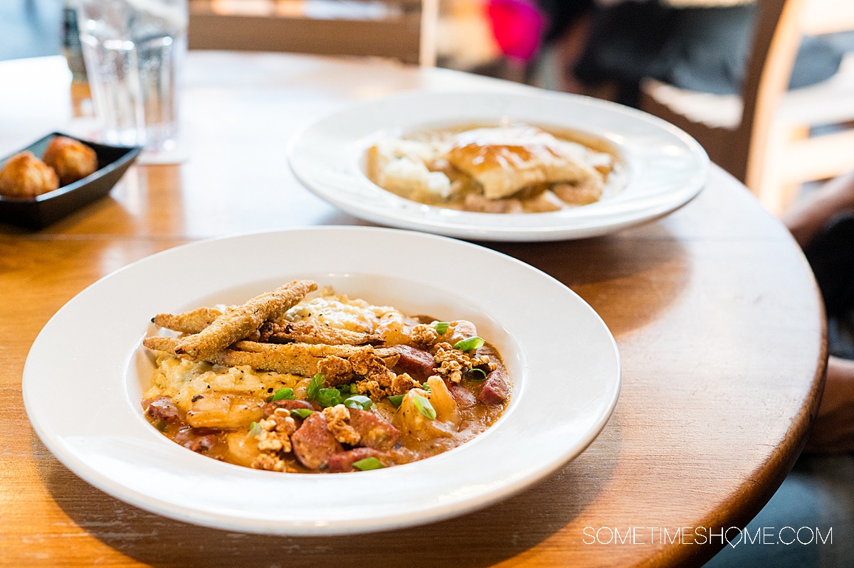 Two bowls of food on a table.